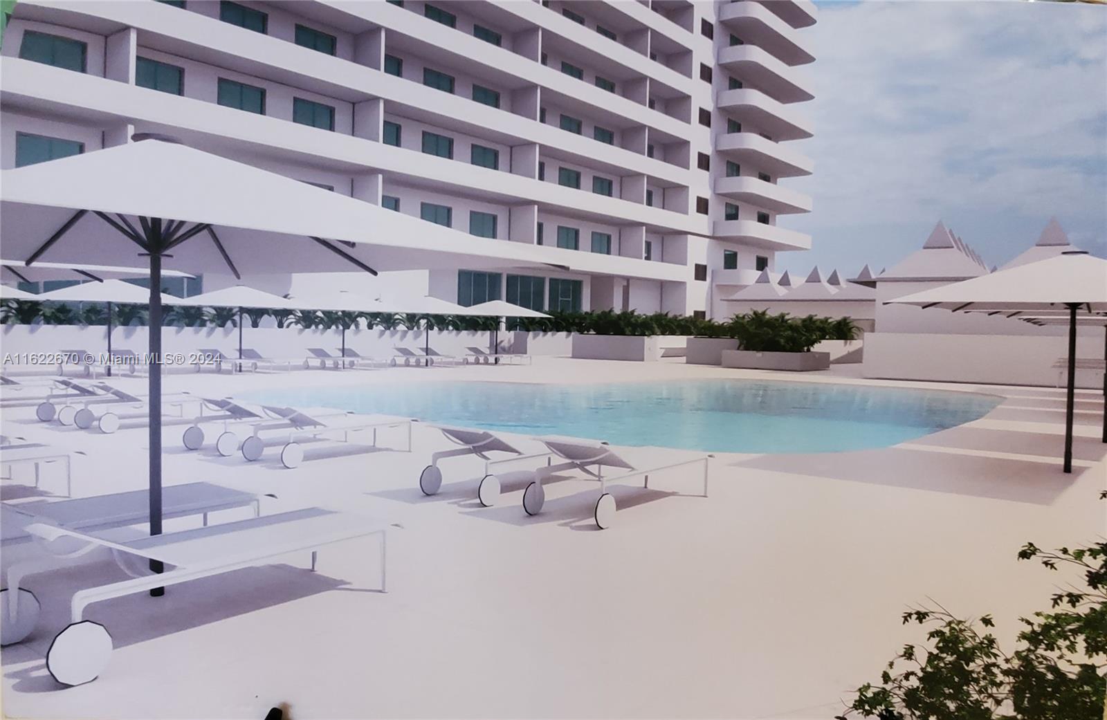 5555 Collins Avenue, Unit 5V Miami Beach, FL 33140 - Photo 44 of 46 a front view of a building with seating area and car parked