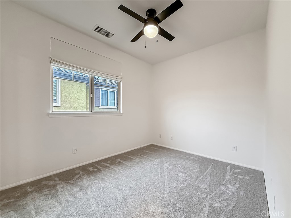 6834 Simmons Way Moorpark, CA 93021 - Photo 20 of 40 an empty room with a window and a ceiling fan