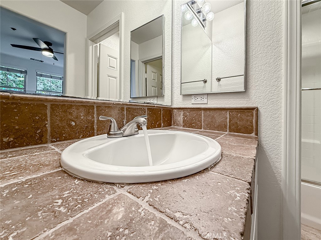 6834 Simmons Way Moorpark, CA 93021 - Photo 31 of 40 a bathroom with a sink and a mirror
