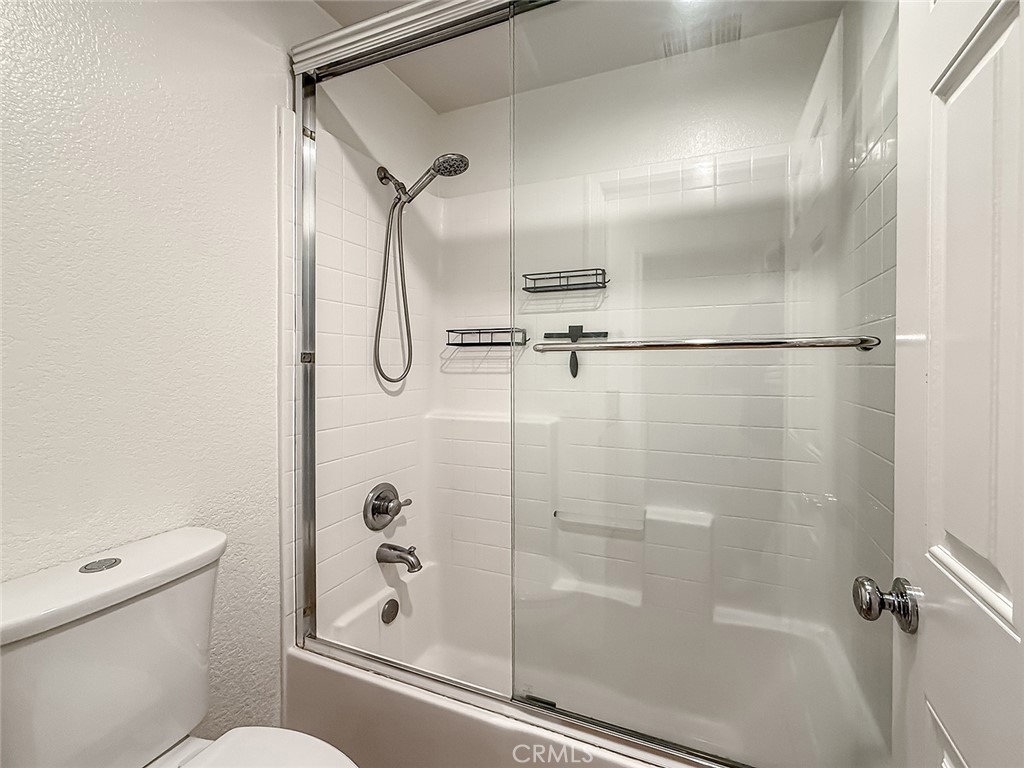 6834 Simmons Way Moorpark, CA 93021 - Photo 32 of 40 a bathroom with a glass shower door