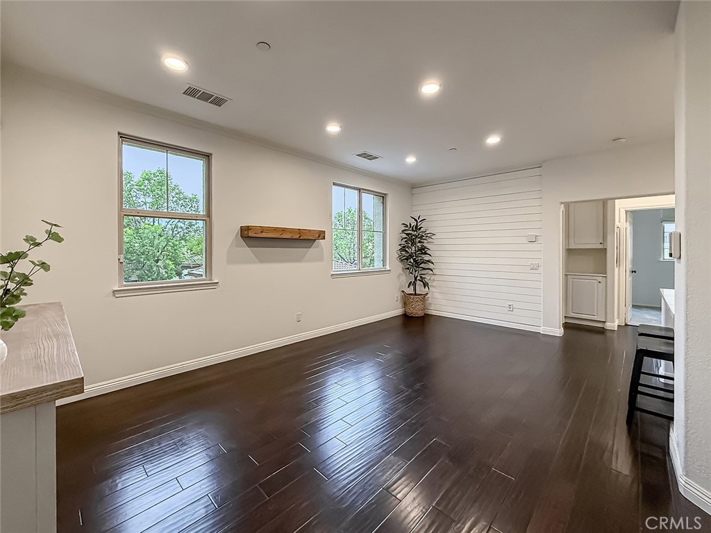 6834 Simmons Way Moorpark, CA 93021 - Photo 6 of 40 an empty room with wooden floor and windows
