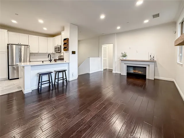 a view of kitchen with cabinets and wooden floor