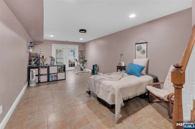 a spacious bedroom with a bed and window