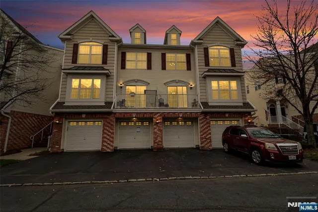 a front view of a house with parking