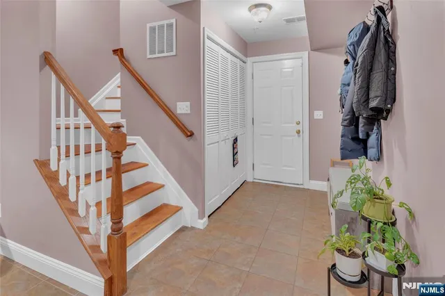 a view of an entryway with flower pots