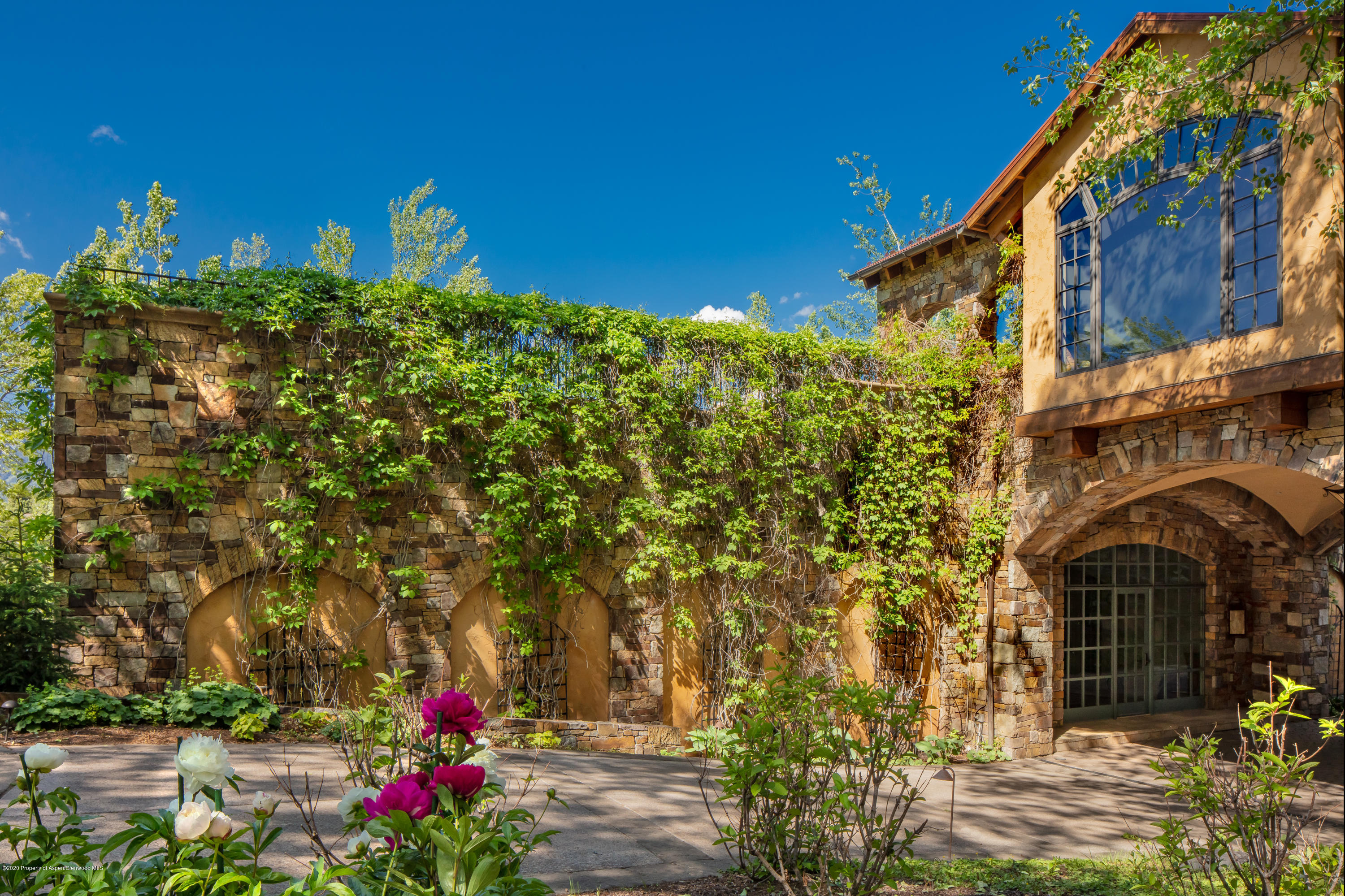 835 Red Mountain Road Aspen, CO 81612 - Photo 18 of 24 a front view of a house with a yard