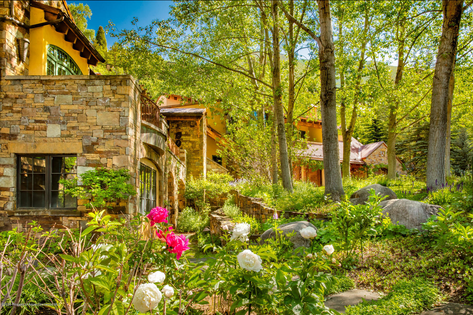 835 Red Mountain Road Aspen, CO 81612 - Photo 20 of 24 front view of a house with a tree