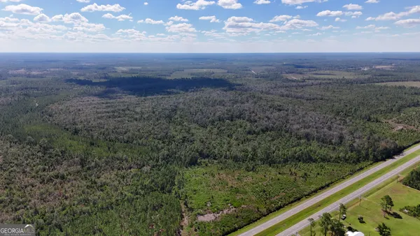 a view of a yard with an outdoor seating