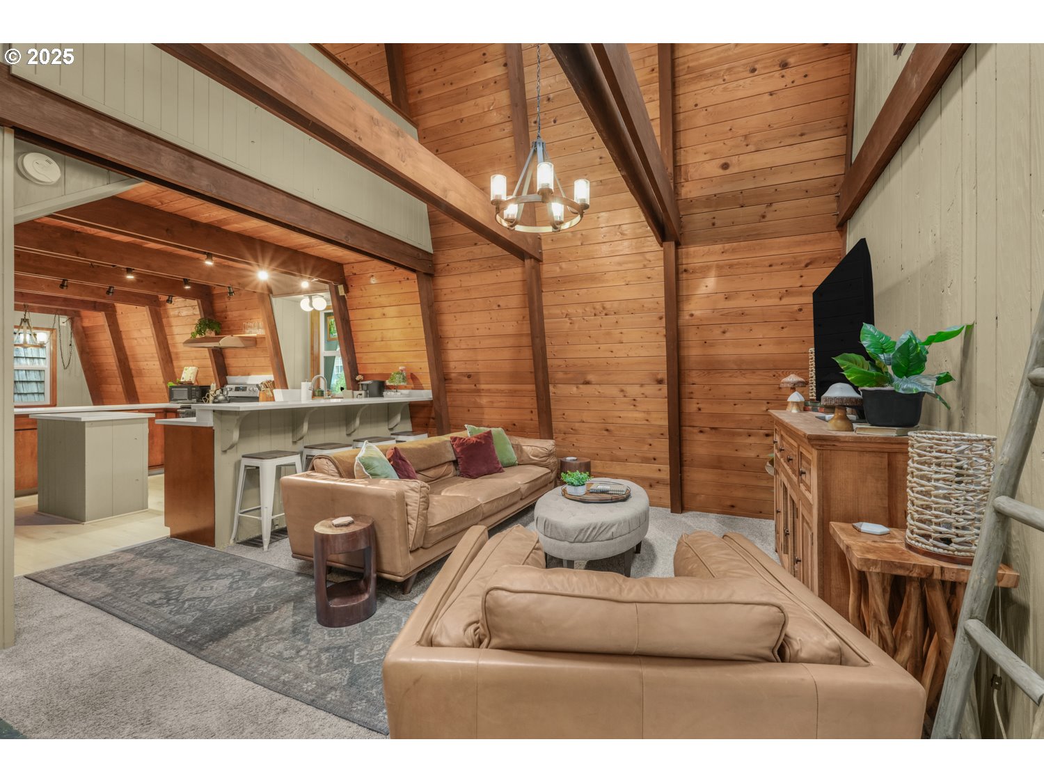 21760 East Tree Swallow Lane Rhododendron, OR 97049 - Photo 5 of 32 a living room with furniture a chandelier and a potted plant