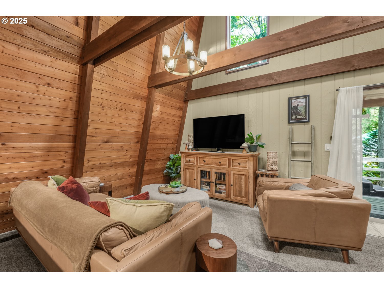 21760 East Tree Swallow Lane Rhododendron, OR 97049 - Photo 6 of 32 a living room with furniture and a flat screen tv