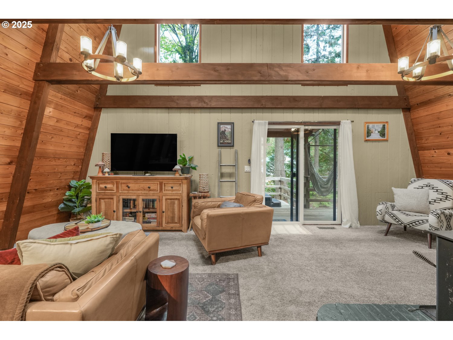 21760 East Tree Swallow Lane Rhododendron, OR 97049 - Photo 7 of 32 a living room with furniture and a flat screen tv