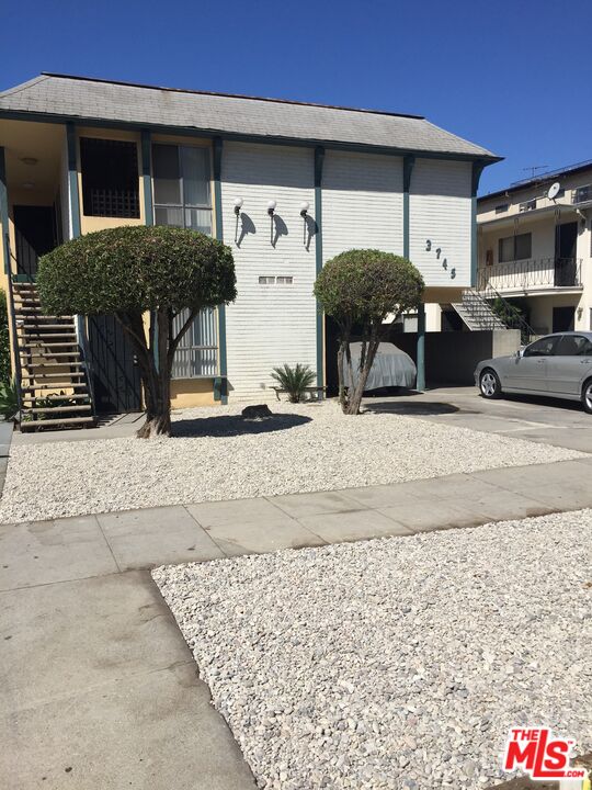 3745 Keystone Avenue, Unit 3 Los Angeles, CA 90034 - Photo 1 of 14 a front view of a house with parking space