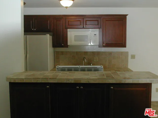 a view of kitchen with a sink