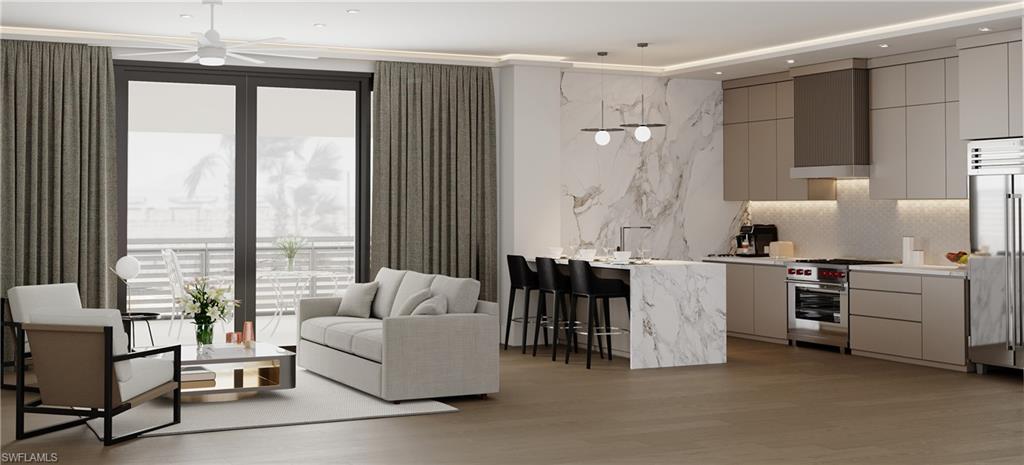 180 9th Street South, Unit 302 Naples, FL 34102 - Photo 2 of 7 a living room with furniture and large windows