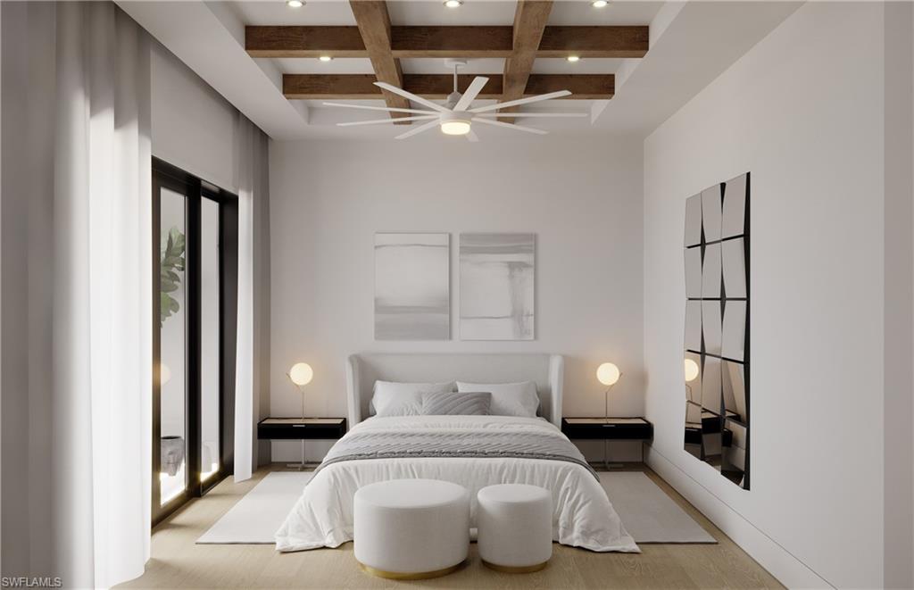 180 9th Street South, Unit 302 Naples, FL 34102 - Photo 3 of 7 a spacious bedroom with a bed and a lamp