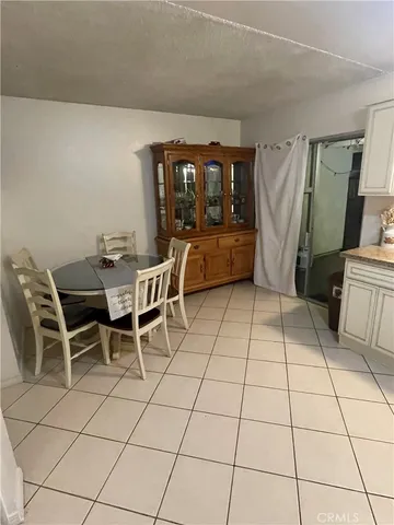 a view of a dining room with furniture and window