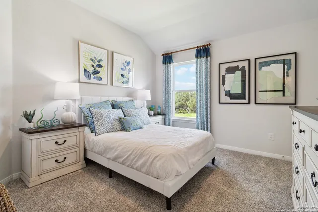 a bedroom with a bed and a dresser