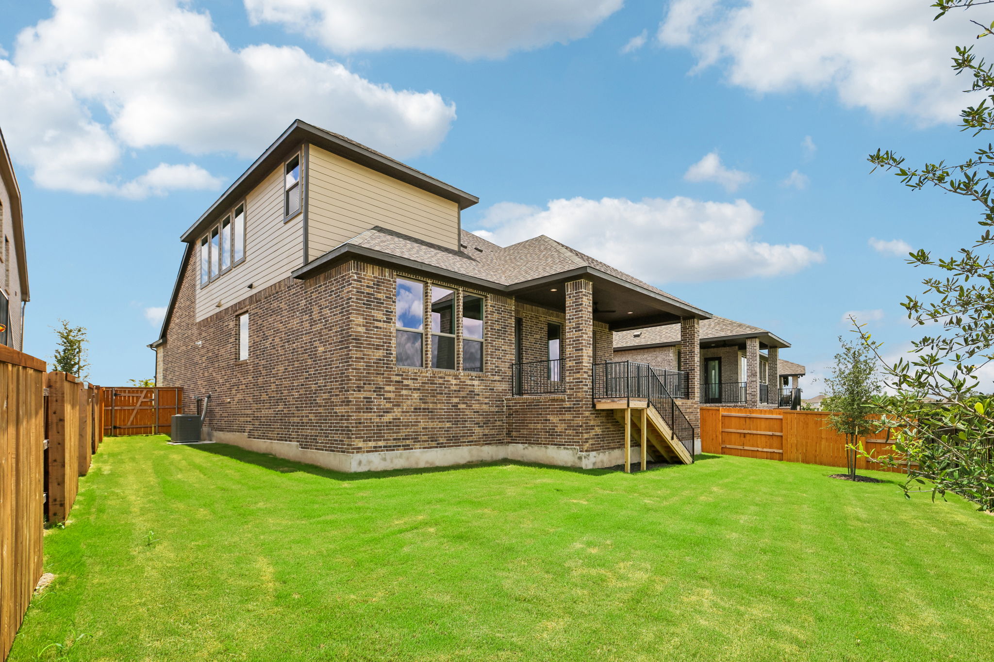 214 Prickly Poppy Loop Kyle, TX 78640 - Photo 34 of 38 a front view of house with yard and green space