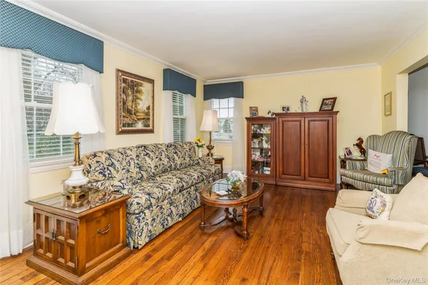 a living room with furniture and a rug