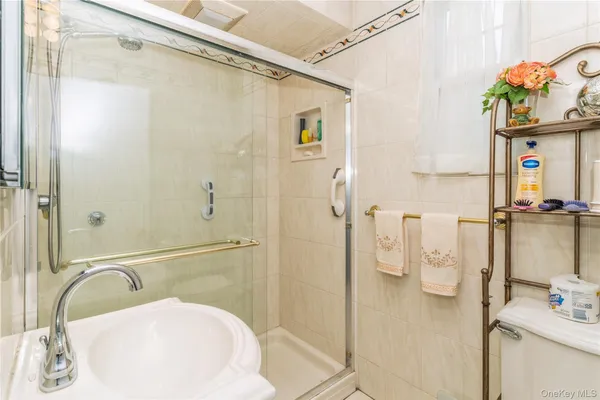 a bathroom with a sink and shower