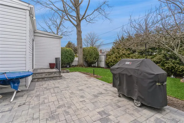 a view of a backyard with sitting area