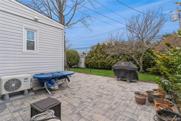a view of a backyard with sitting area