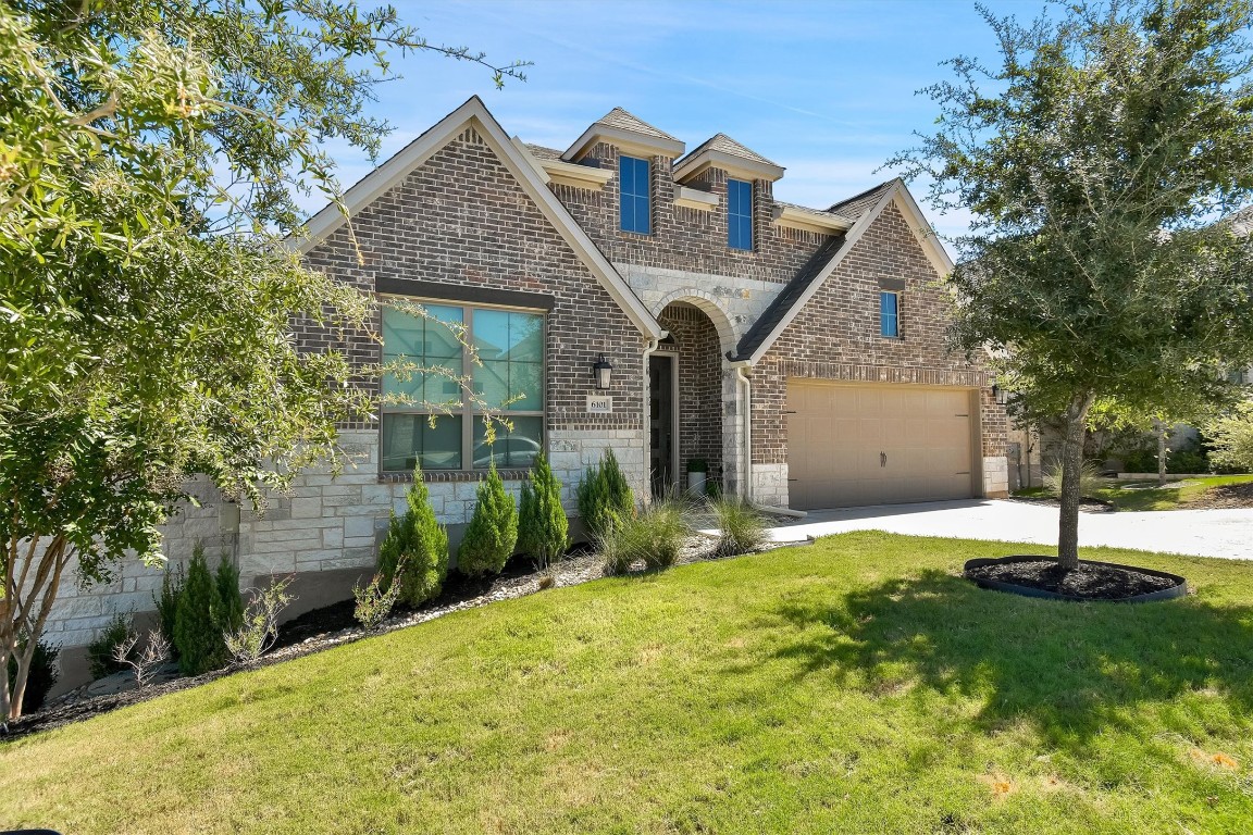 6101 Fadden Road Austin, TX 78738 - Photo 1 of 1 a front view of a house with a yard