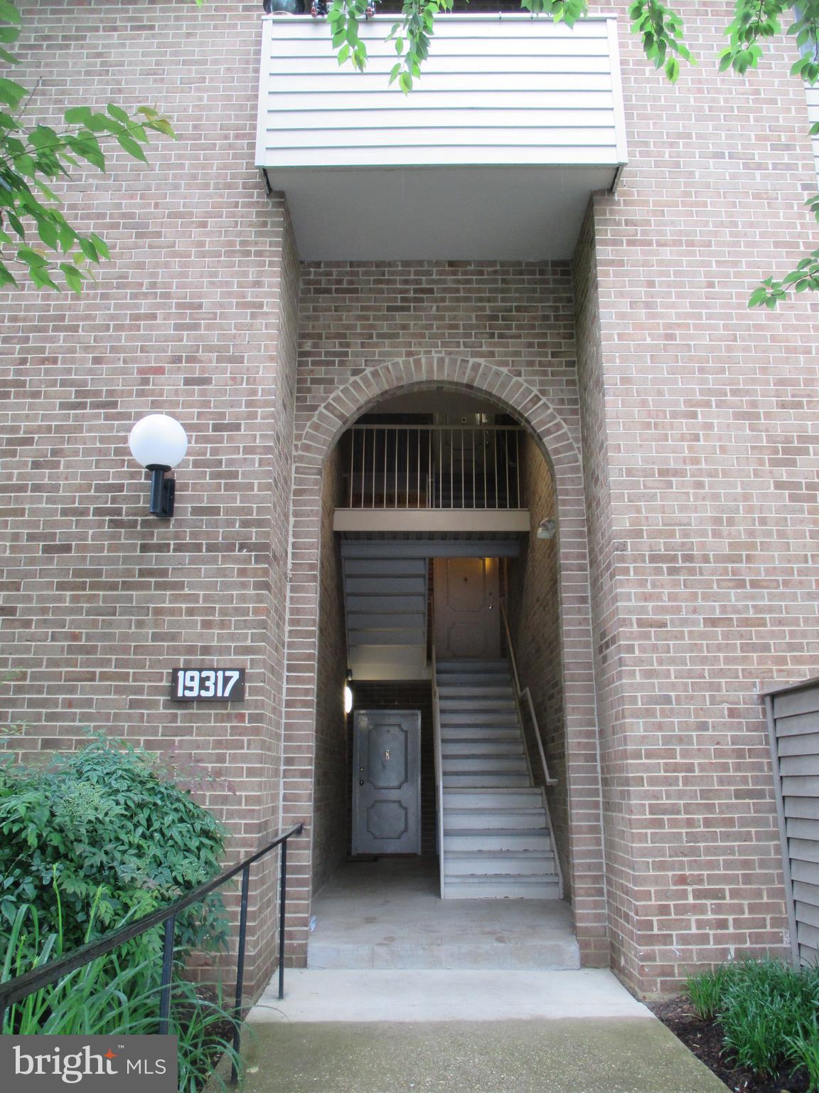 19317 Club House Road, Unit 302 Gaithersburg, MD 20886 - Photo 1 of 18 a front view of a house with stairs