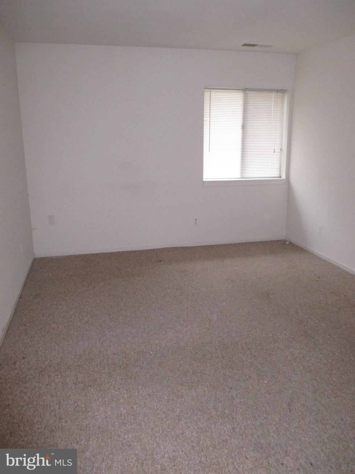 19317 Club House Road, Unit 302 Gaithersburg, MD 20886 - Photo 13 of 18 an empty room with a window