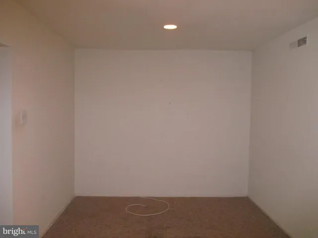 a kitchen with stainless steel appliances a stove a microwave a sink and cabinets