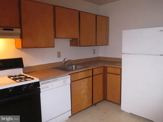 a bathroom with a toilet a sink and bathtub