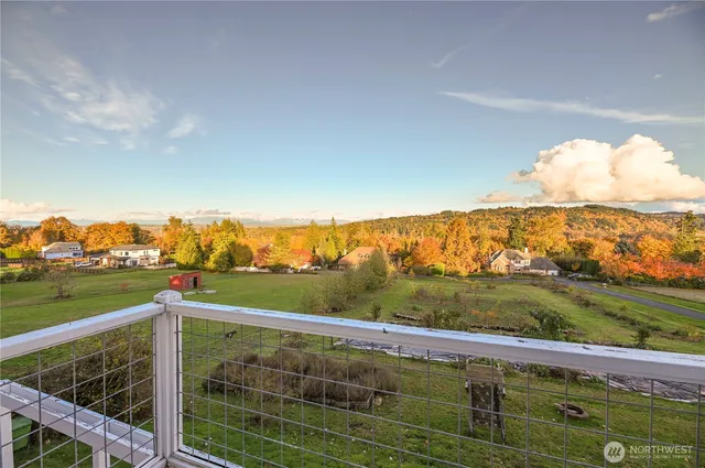 a view of a balcony with an ocean