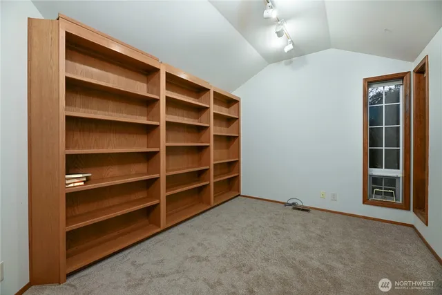 a view of an empty room with a empty shelves