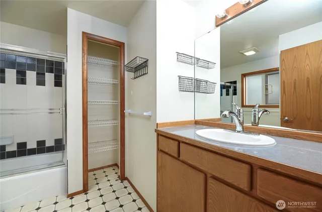 a bathroom with a sink and a mirror