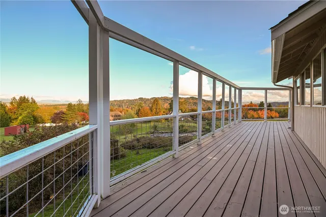 a view of a balcony with wooden floor