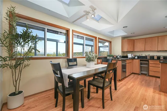 a view of a dining room with furniture window and wooden floor