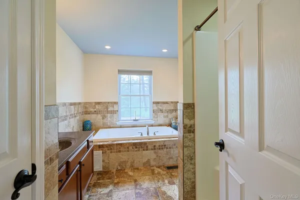 a bathroom with a sink and a bathtub