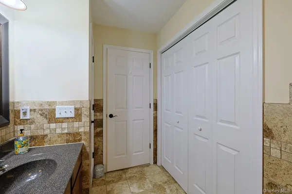 a view of a bathroom with tub shower