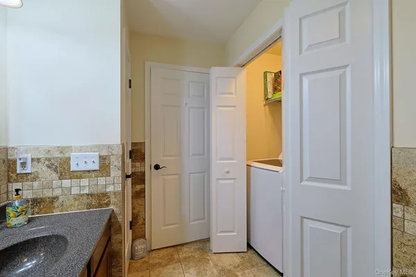 a view of a bathroom with a tub shower and a sink