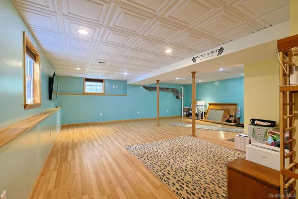 a view of a livingroom with furniture and an empty room