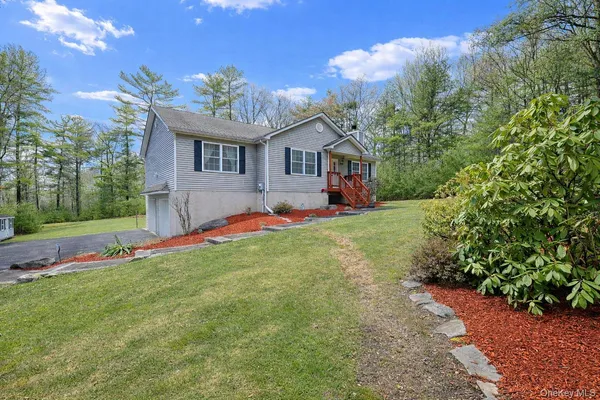 a house view with a garden space