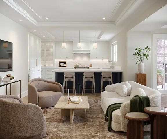 a living room with furniture kitchen view and a window