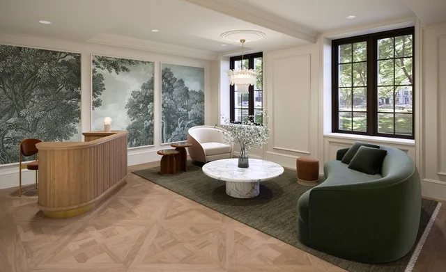 a view of a dining room and furniture with large windows