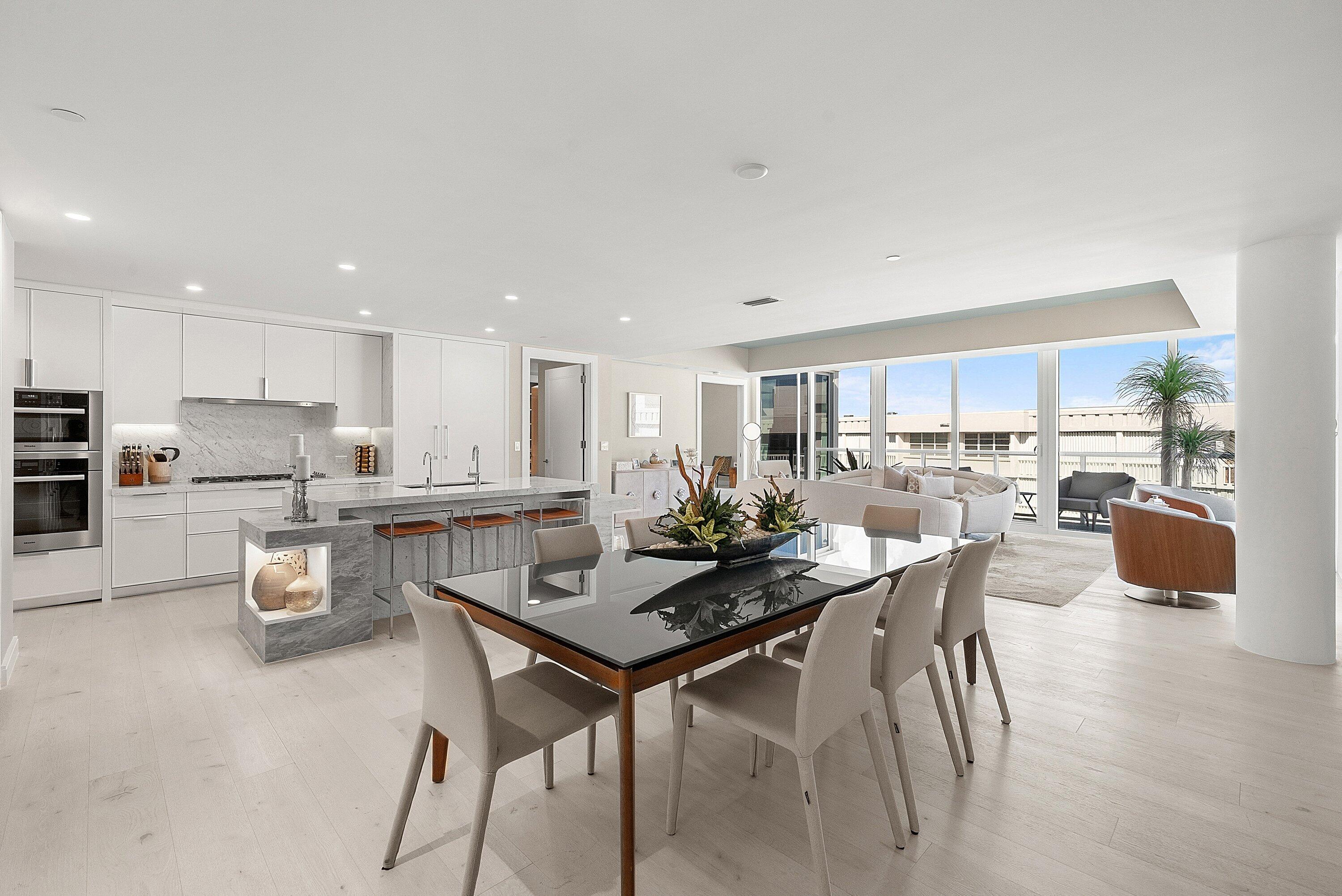 3550 South Ocean Boulevard, Unit 7C South Palm Beach, FL 33480 - Photo 16 of 66 a kitchen with stainless steel appliances kitchen island granite countertop a stove a sink a refrigerator and white cabinets with wooden floor