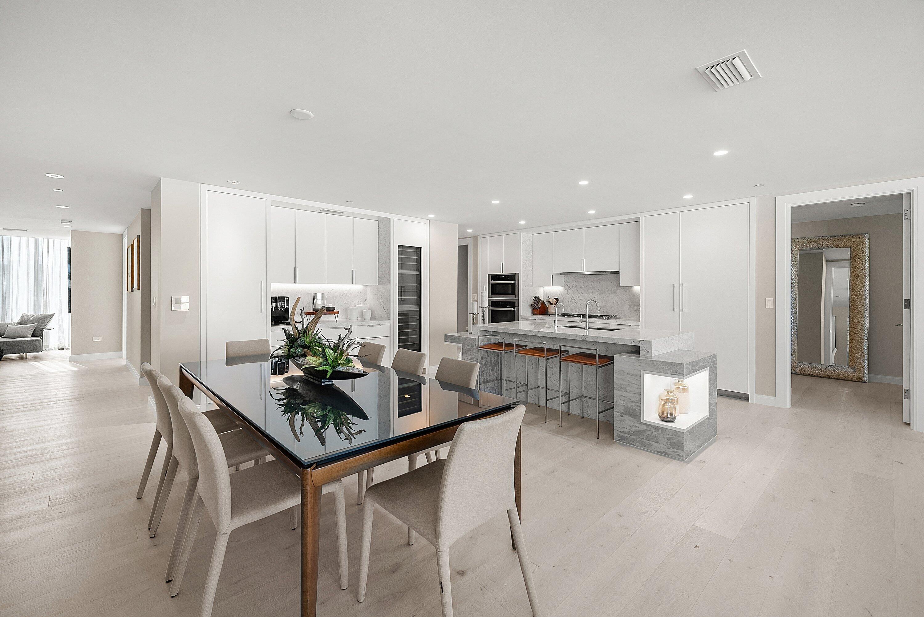 3550 South Ocean Boulevard, Unit 7C South Palm Beach, FL 33480 - Photo 17 of 66 a kitchen with a table and chairs in it