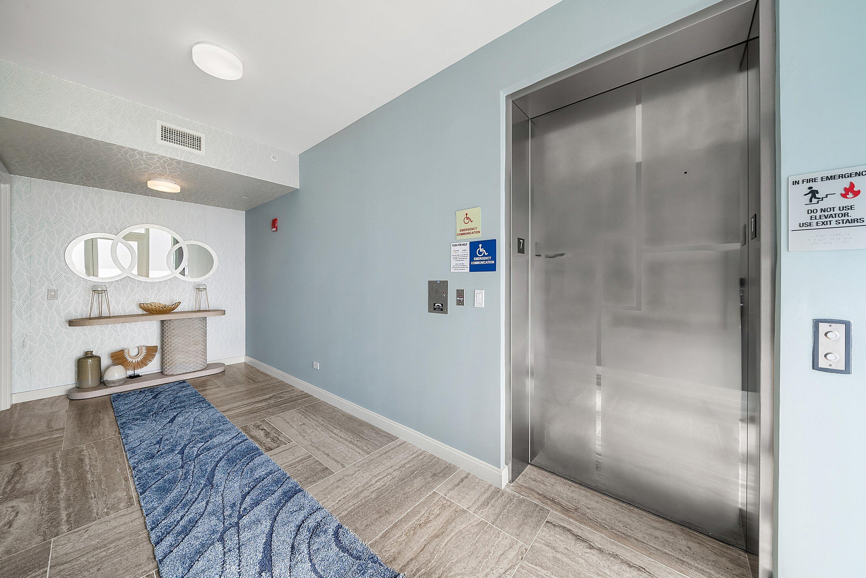 3550 South Ocean Boulevard, Unit 7C South Palm Beach, FL 33480 - Photo 2 of 66 a bedroom with a bed and a glass door shower