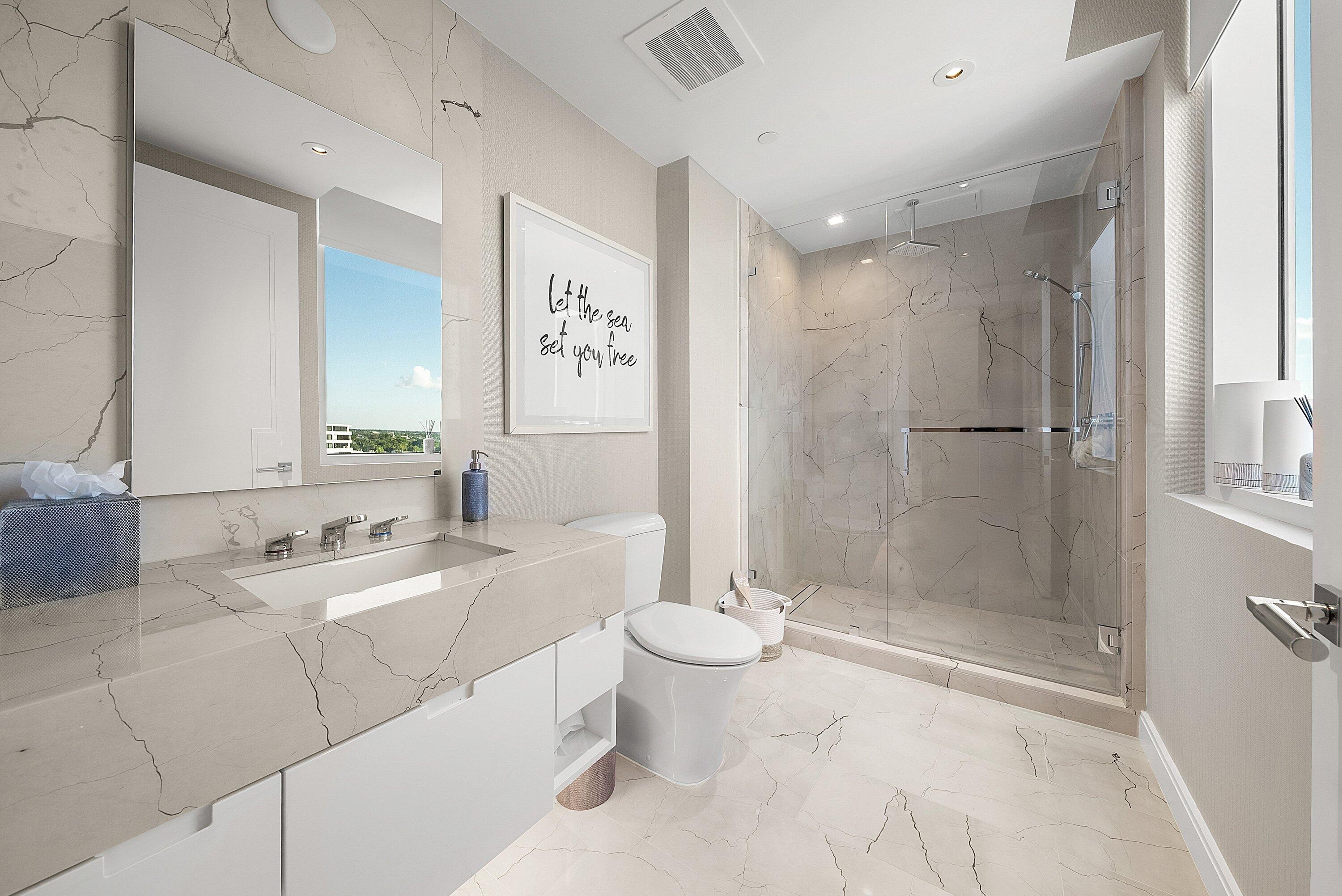 3550 South Ocean Boulevard, Unit 7C South Palm Beach, FL 33480 - Photo 29 of 66 a bathroom with a double vanity sink toilet mirror and shower