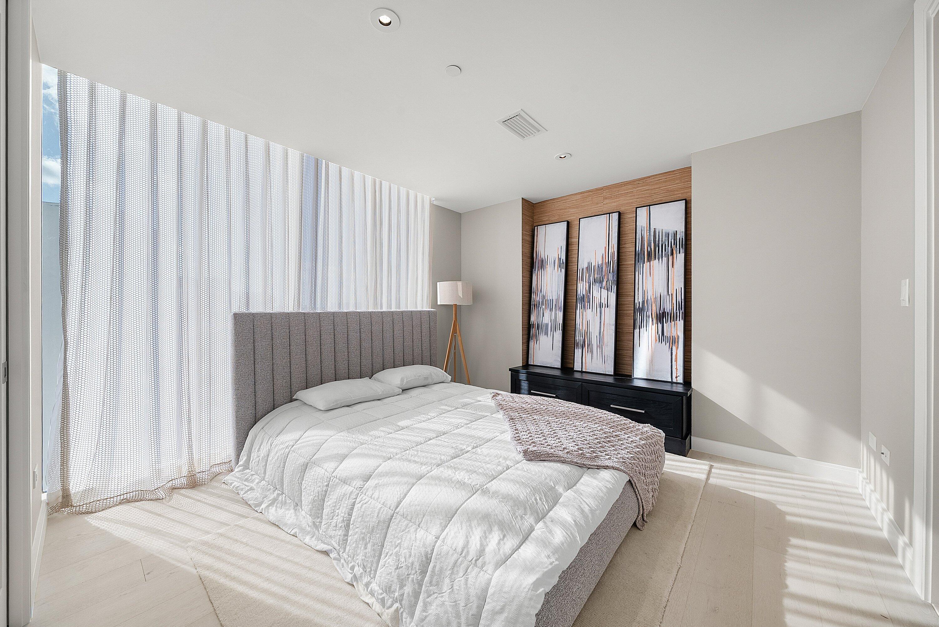 3550 South Ocean Boulevard, Unit 7C South Palm Beach, FL 33480 - Photo 31 of 66 a bedroom with a bed and a window