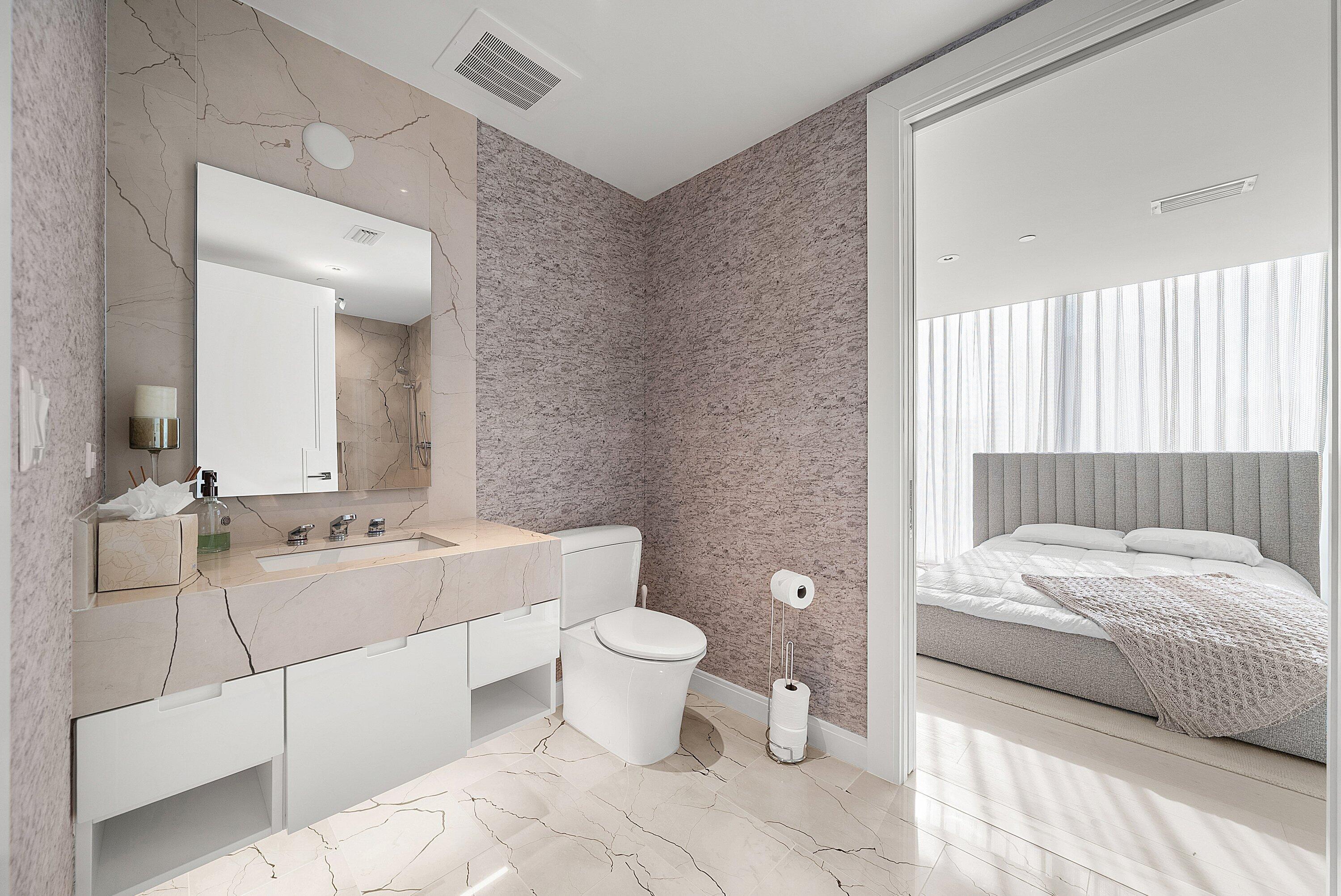 3550 South Ocean Boulevard, Unit 7C South Palm Beach, FL 33480 - Photo 32 of 66 a bathroom with a double vanity sink toilet and shower