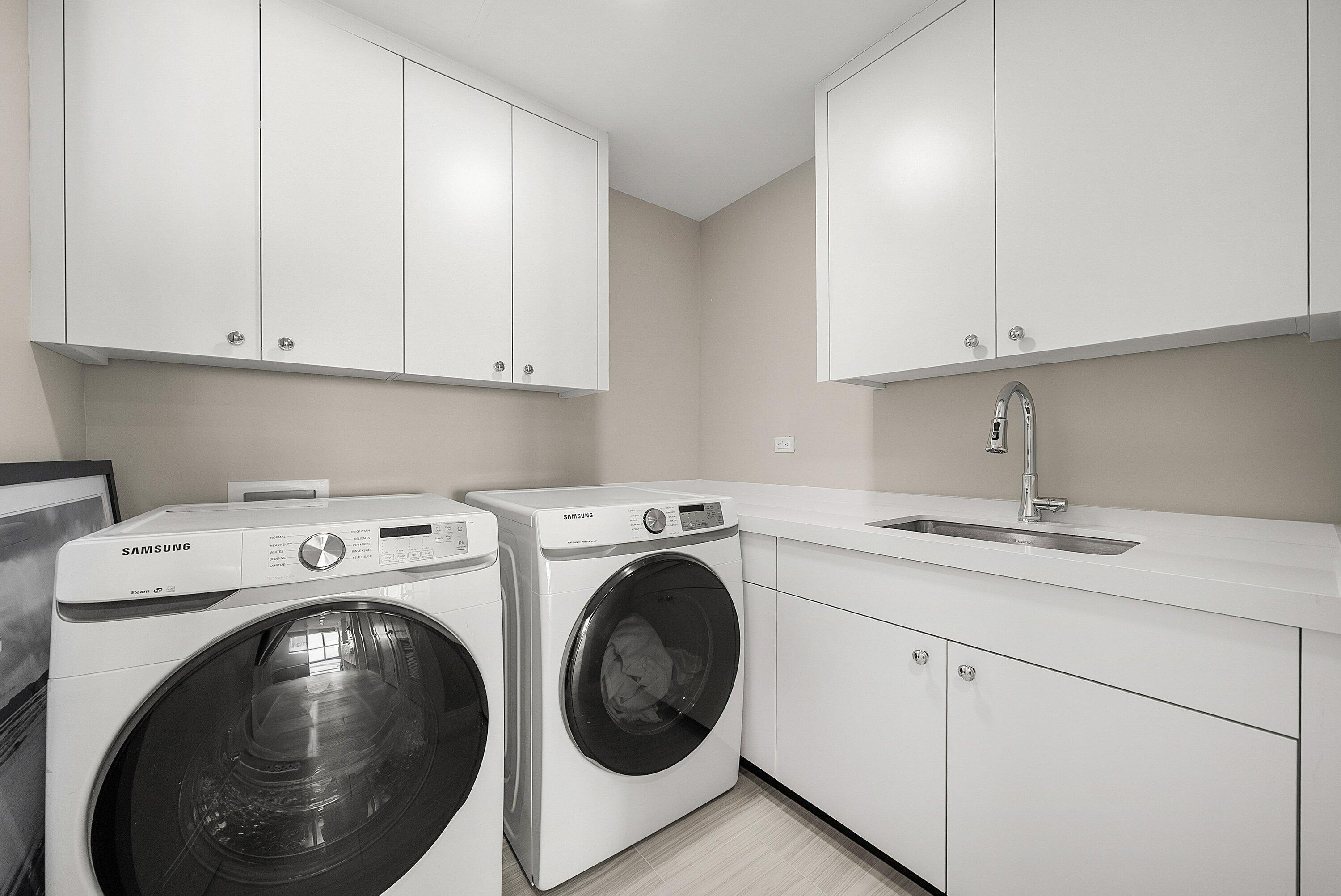3550 South Ocean Boulevard, Unit 7C South Palm Beach, FL 33480 - Photo 34 of 66 a utility room with sink dryer and washer